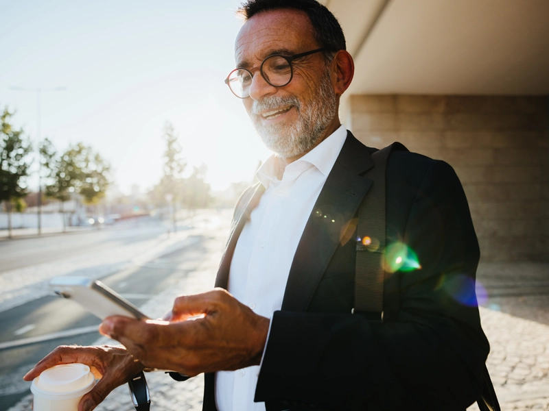 business man looking at phone