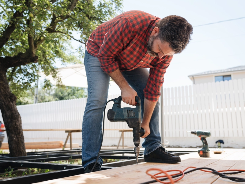 man working on house