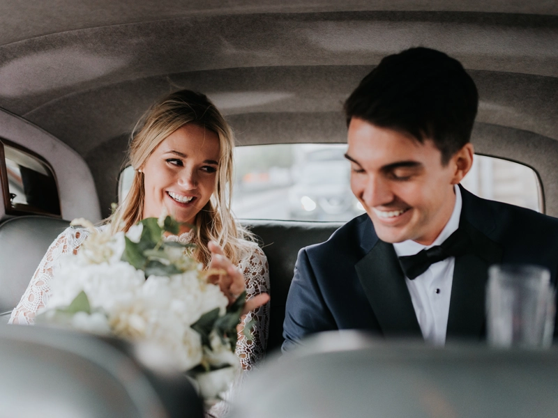 newlyweds in a car