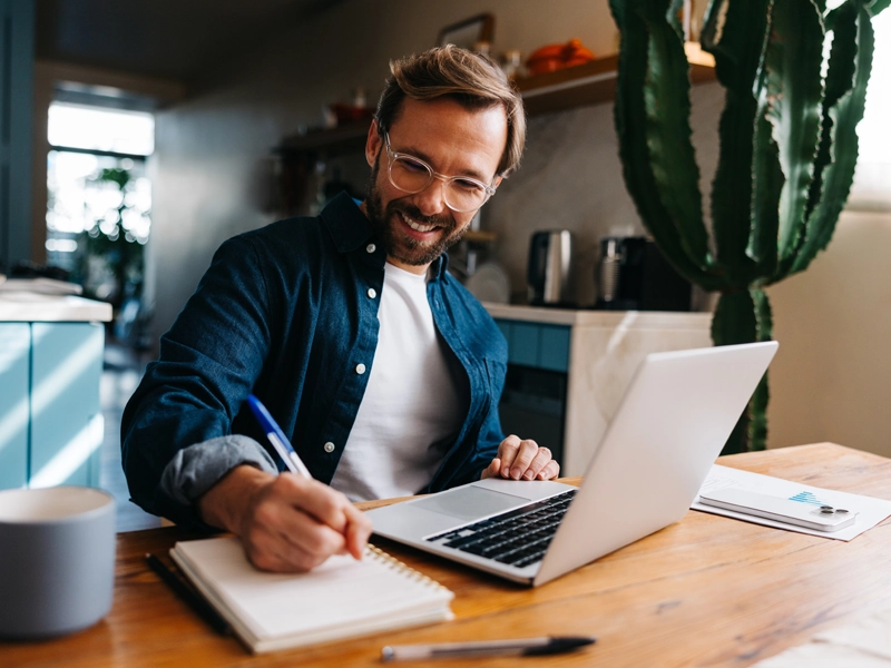 man banking on a laptop