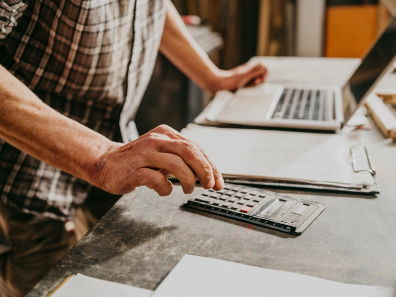man using a calculator