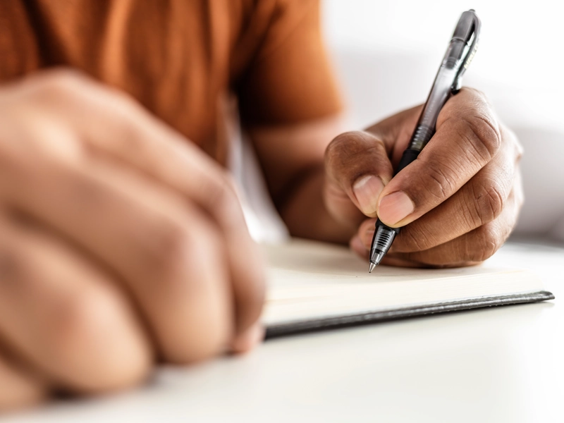 woman writing a check